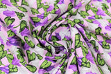Swirled swatch lily fabric (pale pink fabric with white and purple lilies allover with green leaves)