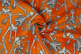 Print "Orange Skeleton Crew" from the Halloween Spirit collection, twisted to show drape and texture.