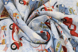 Swirled swatch bikes and trucks fabric (white and light blue marbled/crack effect fabric with red bikes and vespas, cars and trucks, and blue front facing cars allover with american style flags, banners, and floral bouquets)