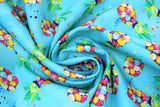 Swirled swatch pineapples fabric (teal blue fabric with tossed abstract style pineapples with circular paint blobs in body and wispy green and yellow stems above)