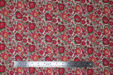 Flat swatch Pink Peonies fabric (white fabric with busy tossed floral and wispy stems allover in red and green with blue and yellow accents)