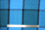 Flat swatch phthalo plaid fabric (bright blue fabric with faded black plaid lines)