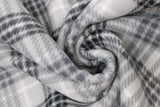 Swirled swatch silver plaid fabric (light grey fabric with busy black and white medium sized plaid print)