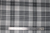 Flat swatch silver plaid fabric (light grey fabric with busy black and white medium sized plaid print)