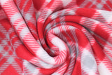 Swirled swatch candycane plaid fabric (deep red fabric with small white and grey plaid lines and squares)