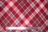 Flat swatch candycane plaid fabric (deep red fabric with small white and grey plaid lines and squares)