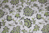 Outdoor polyester print in greenery (off white fabric with florwing green and grey floral/greenery swoopy pattern allover)