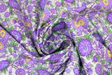 Swirled swatch Purple Peonies fabric (white fabric with busy tossed floral and wispy stems in purple and green leaves with blue and yellow accents)