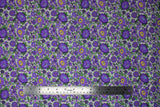 Flat swatch Purple Peonies fabric (white fabric with busy tossed floral and wispy stems in purple and green leaves with blue and yellow accents)