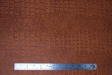 Flat swatch gator textured vinyl in rawhide (medium orangey brown)