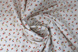 Swirled swatch tiny florals fabric in charmed (coloured flowers on white)