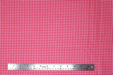 Flat swatch gingham and plaid printed fabric in pink gingham
