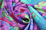 Swirled swatch flower & plant print fabric in lotus leaf (blues/purples)