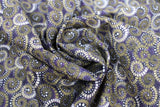 Swirled swatch Swirls & Clouds printed fabric in way under (spirals on dark blue)