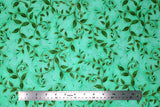 Flat swatch flower & plant print fabric in golden leaves (on green)