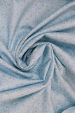 Swirled swatch tiled print fabric in light blue