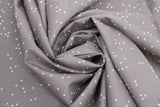 Swirled swatch tiny florals fabric in flower specks (white on grey)