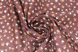Swirled swatch animal themed printed fabric in Paws on Brown