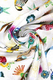 Swirled swatch animal themed printed fabric in Floral Flight White
