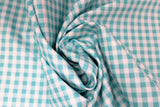 Swirled swatch gingham and plaid printed fabric in blue gingham