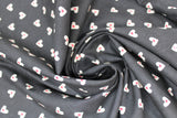 Swirled swatch black hearts fabric (black fabric with white hearts allover with smaller red hearts within)