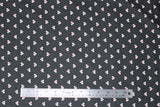 Flat swatch black hearts fabric (black fabric with white hearts allover with smaller red hearts within)