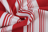 Swirled swatch ruby stripe fabric (white fabric with thick red stripes and groups of small red stripes within the white spaces)