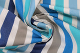 Swirled swatch sapphire stripe fabric (teal, light blue, dark blue, grey, blue striped fabric with smaller white stripes in between each colour)
