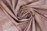 Swirled swatch near solid print fabric in brown