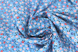 Swirled swatch dots fabric (medium blue fabric with small tossed white, pink, red and blue floral heads and black leaves)