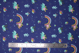 Flat swatch blue fabric (dark blue fabric with small tossed emblems allover rainbows with floral/greenery, small teal and yellow snails with pink flower petals, teal coloured rocks, tiny teal and yellow dots and stars)