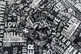 Swirled swatch winter printed fabric in Text on Black (winter words)