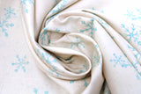 Swirled swatch winter printed fabric in Blue Snowflakes on Cream