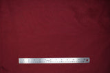 Flat swatch burgundy sheer fabric with subtle sparkle/sheen look effect