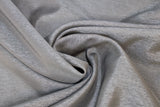 Swirled swatch charcoal grey sheer fabric with subtle sparkle/sheen look effect