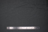 Flat swatch charcoal grey sheer fabric with subtle sparkle/sheen look effect