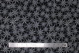 Flat swatch Spiderwebs fabric (black fabric with subtle grey distressed look marks and busy tossed white spiderwebs allover)