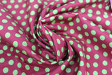 Swirled swatch Green Spots on Burgundy fabric