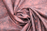 Swirled swatch small faded stars printed fabric in burgundy