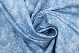 Swirled swatch small faded stars printed fabric in blue