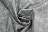 Swirled swatch small faded stars printed fabric in green