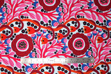 Flat swatch summer themed fabric in Colourful Flowers (red/orange)