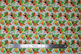 Flat swatch Birds fabric (white fabric with red parrots, black toucans, and green/yellow/red tropical style birds repeated all with coloured floral and green leaves underneath)