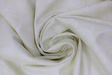 Swirled swatch natural stump fabric (white fabric with off white circular cut log ends design allover)