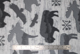 Flat swatch moose eagle buffalo fabric (light grey fabric with a slight weathered look and grey silhouettes of moose, eagles and buffalo some with grey horizon lines within, tossed directional arrows and "N E S W" letters)