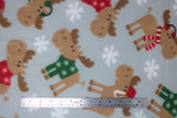 Flat swatch moose in sweaters fabric (light grey fabric with tossed brown cartoon moose in red and green christmas sweaters with white snowflakes and tossed white snowflakes)