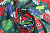 Swirled swatch Christmas printed fabric in Presents on Dark Green