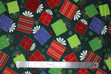Flat swatch Christmas printed fabric in Presents on Dark Green